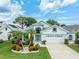 Charming single Gathering home with beautiful landscaping and attached two car garage at 1221 Siesta Key Cir, Port Orange, FL 32128