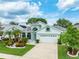 Charming single-Gathering home with landscaped front yard, manicured lawn and a two-car garage at 1221 Siesta Key Cir, Port Orange, FL 32128