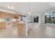 Open kitchen with white appliances, tiled flooring, and breakfast bar at 1221 Siesta Key Cir, Port Orange, FL 32128