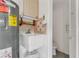 This functional laundry room has a utility sink, extra storage and room for a toilet at 1221 Siesta Key Cir, Port Orange, FL 32128