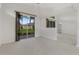 Open living room with sliding glass doors leading to the outdoor area at 1221 Siesta Key Cir, Port Orange, FL 32128