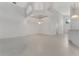 Elegant living room with vaulted ceilings and stylish light fixtures at 1221 Siesta Key Cir, Port Orange, FL 32128
