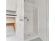 A simple, white fiberglass shower stall is easy to clean and maintain at 1221 Siesta Key Cir, Port Orange, FL 32128