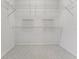 Spacious walk-in closet with neutral carpet and white wire shelving system for optimal organization at 1221 Siesta Key Cir, Port Orange, FL 32128