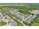 Scenic aerial view of townhomes and a nearby pond, creating a peaceful neighborhood atmosphere at 1453 River Rock Ct, Oviedo, FL 32765
