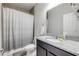 Bathroom with large mirror, granite countertop, and shower with curtain at 1453 River Rock Ct, Oviedo, FL 32765