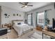 Comfortable bedroom with carpeted floor, ceiling fan, and windows bringing lots of natural light at 1453 River Rock Ct, Oviedo, FL 32765