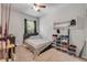 Bedroom with ceiling fan, storage, and a neutral color scheme at 1453 River Rock Ct, Oviedo, FL 32765