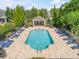 Relaxing community pool area with lounge chairs and a covered pavilion for residents at 1453 River Rock Ct, Oviedo, FL 32765