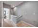 Bright hallway with neutral tones and carpeted floor leading to the bedrooms of the residence at 1453 River Rock Ct, Oviedo, FL 32765