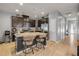 Bright kitchen featuring dark cabinetry, stainless steel appliances, and granite countertops with breakfast bar at 1453 River Rock Ct, Oviedo, FL 32765