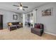 Comfortable living room featuring tile flooring and sliding glass doors to the outdoor screened-in patio at 1453 River Rock Ct, Oviedo, FL 32765