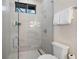 Clean bathroom featuring a glass-enclosed shower, modern fixtures, and neutral color palette at 1616 Turnbull Crossings Dr, New Smyrna Beach, FL 32168