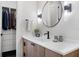 Modern bathroom featuring a sleek vanity with a white countertop and an elegant black faucet at 1616 Turnbull Crossings Dr, New Smyrna Beach, FL 32168