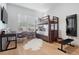 Bright bedroom with stylish bunk bed, modern desk, and large windows providing ample natural light at 1616 Turnbull Crossings Dr, New Smyrna Beach, FL 32168