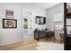 Bright bedroom with modern desk, decorative artwork, and large windows providing ample natural light at 1616 Turnbull Crossings Dr, New Smyrna Beach, FL 32168