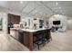 Bright kitchen featuring white countertops, wood cabinets, stainless appliances, and island seating at 1616 Turnbull Crossings Dr, New Smyrna Beach, FL 32168
