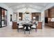 Elegant kitchen with wooden cabinets, large island with seating, and open floor plan at 1616 Turnbull Crossings Dr, New Smyrna Beach, FL 32168