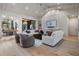 Open living room with high ceilings, modern decor, fireplace, and seamless access to the outdoor space at 1616 Turnbull Crossings Dr, New Smyrna Beach, FL 32168