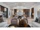 Open-concept living area with a kitchen, modern lighting, and stylish decor at 1616 Turnbull Crossings Dr, New Smyrna Beach, FL 32168