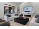 Stylish living room featuring a modern fireplace, sleek furnishings, and a seamless connection to the outdoor patio at 1616 Turnbull Crossings Dr, New Smyrna Beach, FL 32168