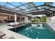 Spectacular pool area with plenty of seating and a summer kitchen with inside access at 1616 Turnbull Crossings Dr, New Smyrna Beach, FL 32168