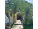 Front entrance with mature tropical landscaping leading up to a beautiful double door entry at 1743 Jacobs Rd, South Daytona, FL 32119