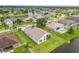 An expansive aerial view of a Gathering-friendly neighborhood featuring well-maintained homes, waterfront and tree lined streets at 1809 Forough Cir, Port Orange, FL 32128