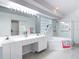 Bright bathroom featuring double vanity, modern tub, and glass-enclosed shower at 1809 Forough Cir, Port Orange, FL 32128