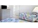 Bedroom with twin beds, white dresser, and closet creating a cozy retreat at 1809 Forough Cir, Port Orange, FL 32128