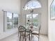 Breakfast nook boasts water views, vaulted ceiling and an elegant chandelier at 1809 Forough Cir, Port Orange, FL 32128