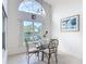 Dining area with lovely lake views, vaulted ceiling and picture on the wall at 1809 Forough Cir, Port Orange, FL 32128