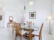 Dining room featuring a glass table, seating for four, and a chandelier at 1809 Forough Cir, Port Orange, FL 32128