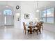 Dining room with a glass table, seating for four, and lots of natural light at 1809 Forough Cir, Port Orange, FL 32128