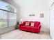 Cozy room bathed in natural light from a large window at 1809 Forough Cir, Port Orange, FL 32128