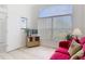 Bright living room with a large window, light floors and a comfortable pink couch at 1809 Forough Cir, Port Orange, FL 32128