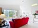 Open-concept living room with bright interior and seamless access to patio at 1809 Forough Cir, Port Orange, FL 32128