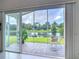 Relaxing screened-in patio offering picturesque views of the tranquil pond at 1809 Forough Cir, Port Orange, FL 32128