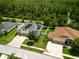 An aerial view of a home and yard highlighting its proximity to green space and neighborhood at 19 Abacus Ave, Ormond Beach, FL 32174
