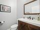 Bathroom featuring dark wood vanity with a white countertop, toilet, and neutral walls at 19 Abacus Ave, Ormond Beach, FL 32174