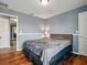 Bedroom featuring hard wood floors, neutral colored walls, and view into hall at 19 Abacus Ave, Ormond Beach, FL 32174