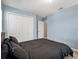 Bedroom with carpet, double door closet, and a view into the ensuite bathroom at 19 Abacus Ave, Ormond Beach, FL 32174
