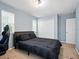 Comfortable bedroom with carpet, desk, and closet with double doors at 19 Abacus Ave, Ormond Beach, FL 32174