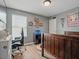 Baseball-themed bedroom featuring hardwood floors, desk with gaming chair, and natural light at 19 Abacus Ave, Ormond Beach, FL 32174
