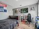 Cozy bedroom with hardwood floors, desk, aquarium, and decor at 19 Abacus Ave, Ormond Beach, FL 32174