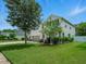 Beautiful two-story home showcasing a well-kept lawn and an attached two car garage at 19 Abacus Ave, Ormond Beach, FL 32174