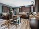 Well-equipped kitchen featuring an island, granite countertops, and ample cabinetry with wood look floors at 19 Abacus Ave, Ormond Beach, FL 32174