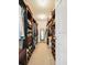This walk-in closet has built in shelves and drawers and a carpet floor at 19 Abacus Ave, Ormond Beach, FL 32174