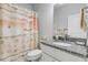 Bathroom featuring a vanity with granite countertop, toilet, and a shower with beach themed curtain at 1929 Pioneer Trl, New Smyrna Beach, FL 32168