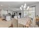 Bright dining room overlooking the kitchen and living room area of the home at 1929 Pioneer Trl, New Smyrna Beach, FL 32168